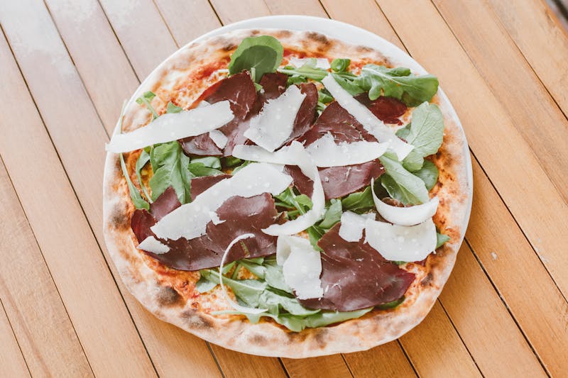 Arugula and prosciutto salad with shaved parmesan