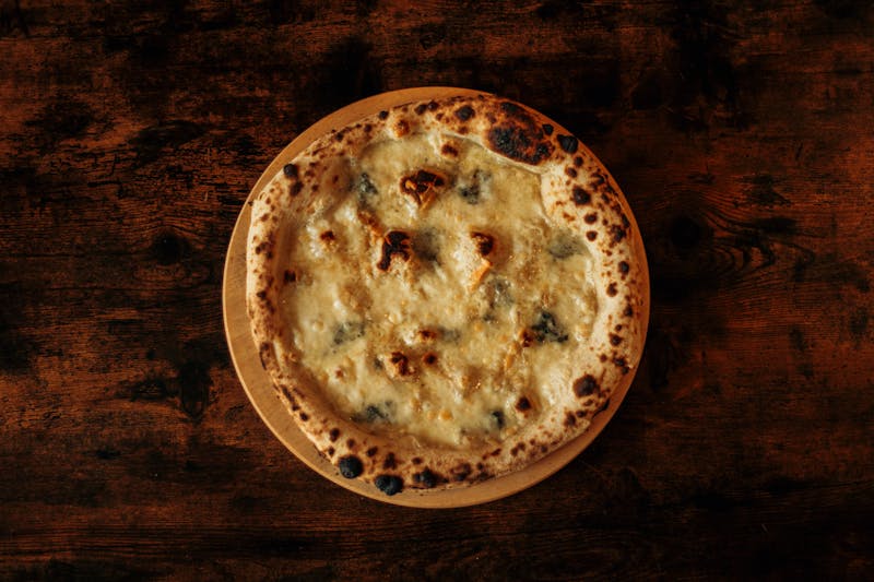 Golden roasted garlic knots served with marinara dipping sauce